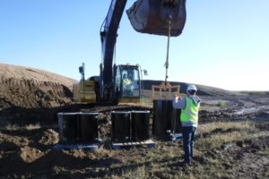 Construction crew dredging land