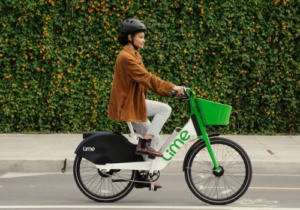 Woman riding lime bike