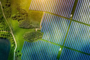 Aerial view over Solar cells energy farm in countryside landscape