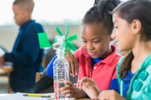 Students building windmill during elementary science class