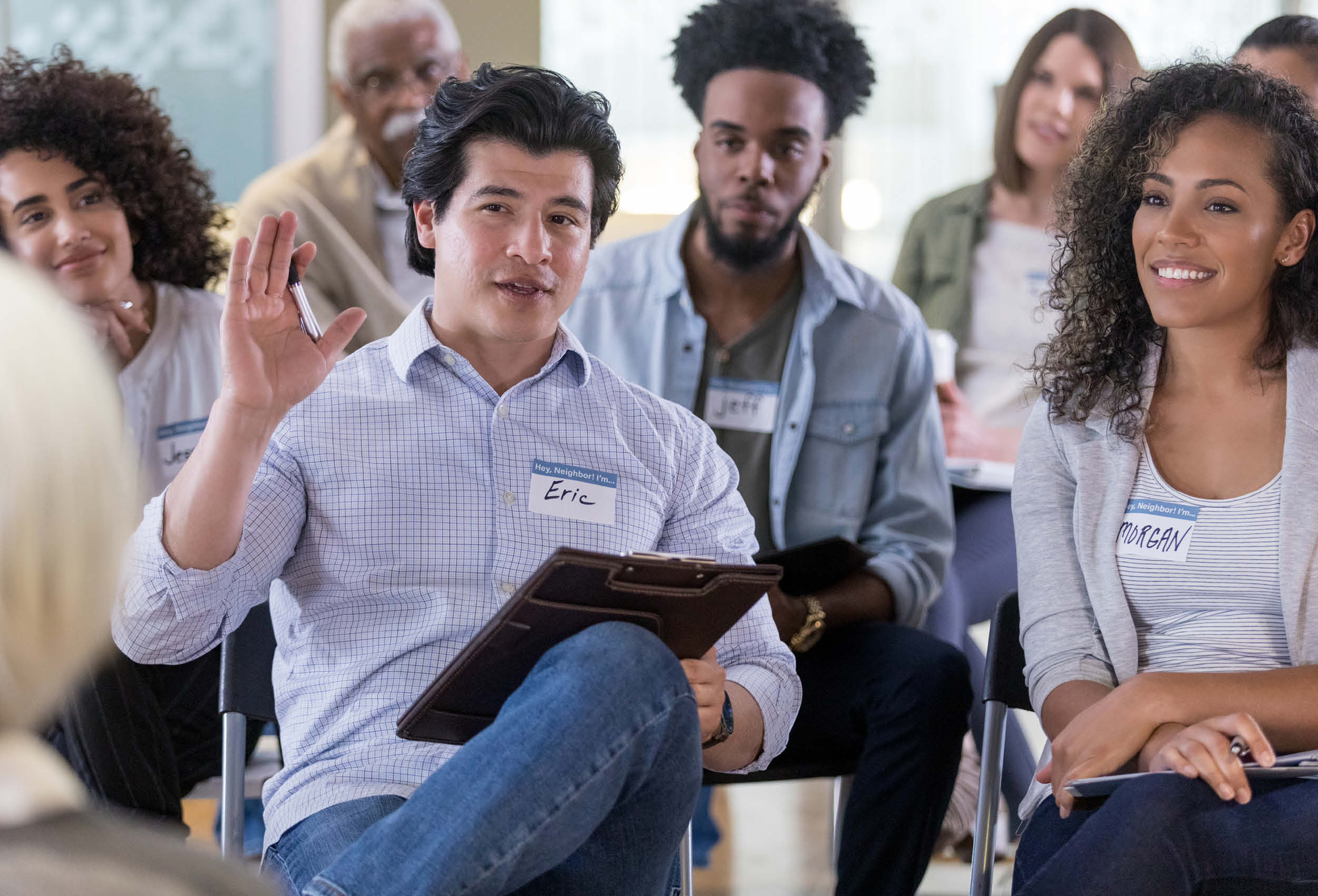 Man asks question during meeting