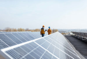 Engineers walk through solar power plant.