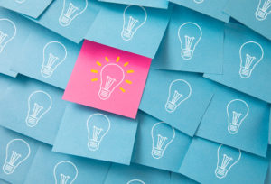 lightbulbs drawn on colorful post it notes.