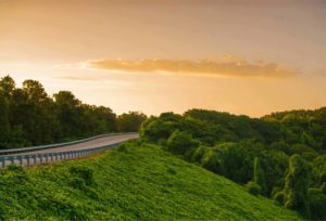 view of rural road at sunset