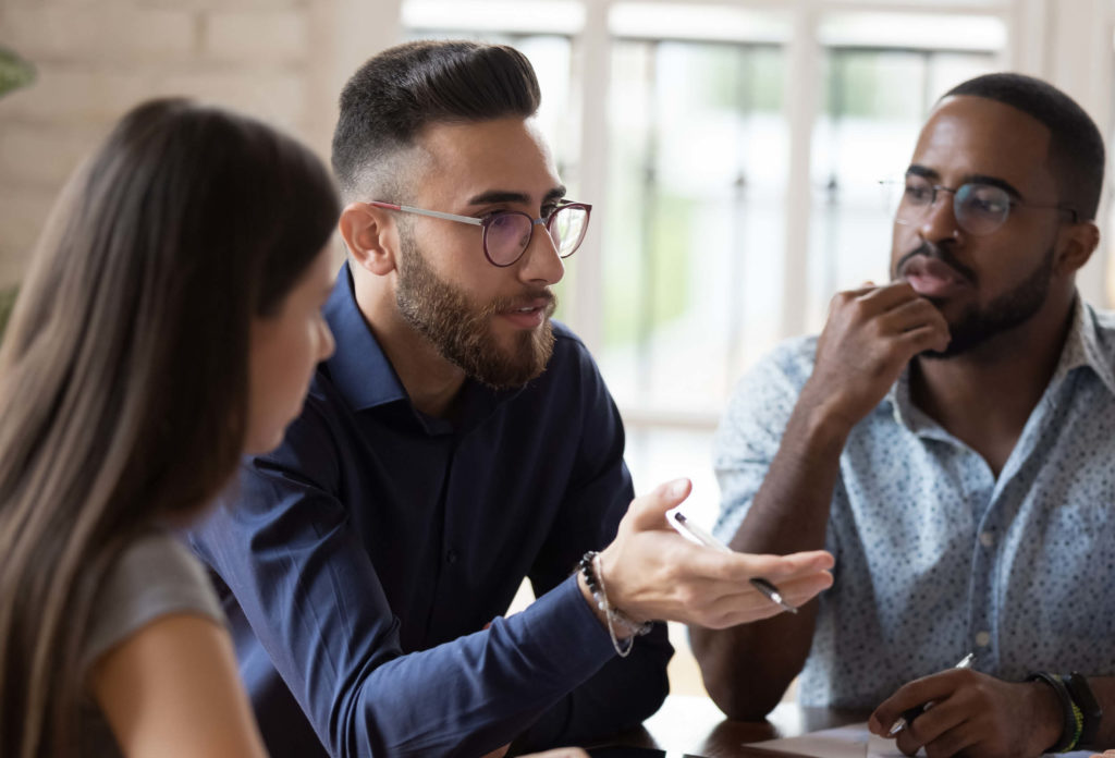 Group of colleagues discuss work