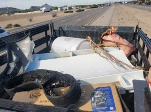 Truck with litter from highway