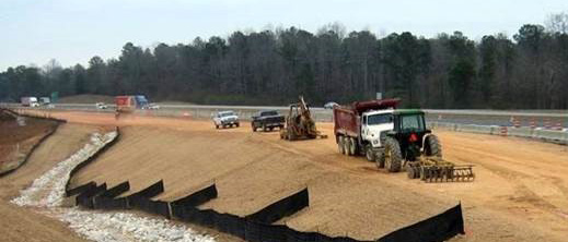 Example of the installation of silt fencing, drainage channel protection, along with seeding and straw to prevent the erosion of soil during construction of our roadways.