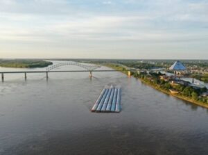 A river with a large bridge over it.