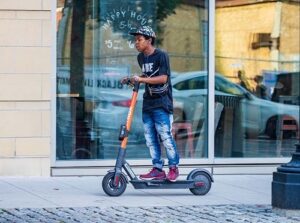 Person riding an electric scooter.