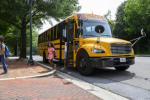 Students getting off of school bus